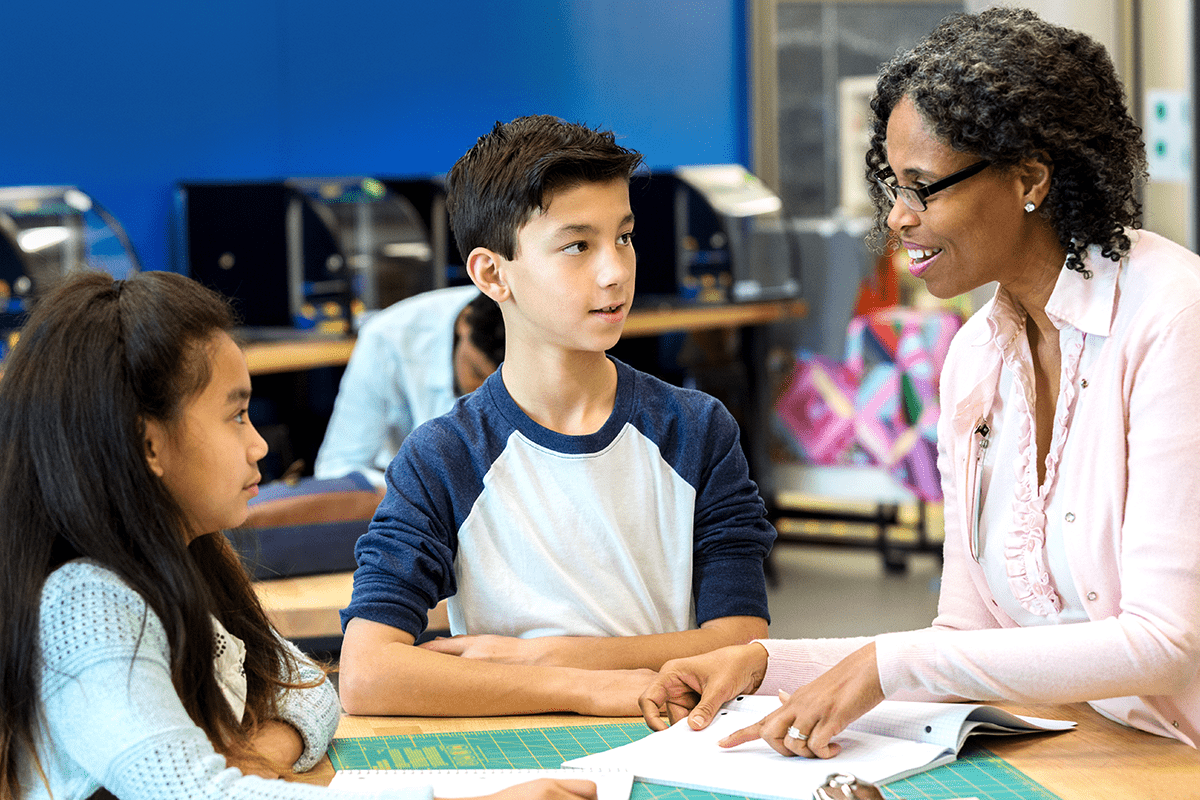 teacher explaining math to her students