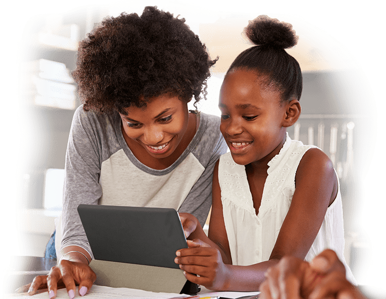 Mom and daughter looking at a tablet in their kitchen