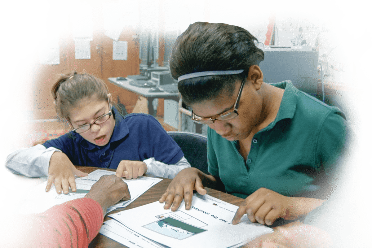 Students working on a lesson with a shared computer