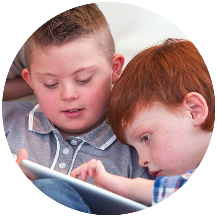 Two elementary students sharing a tablet while learning