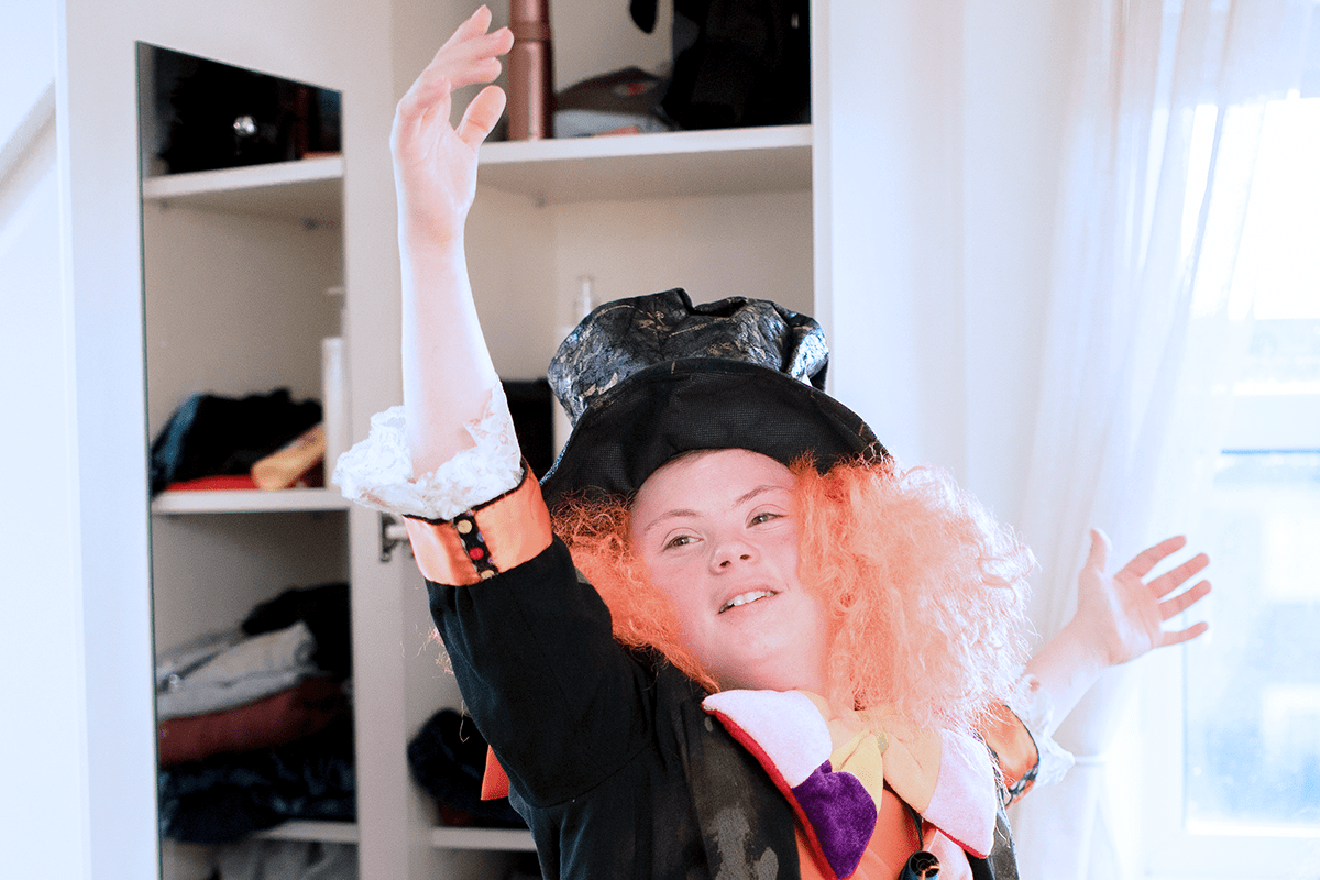 teen playing dress up with costumes